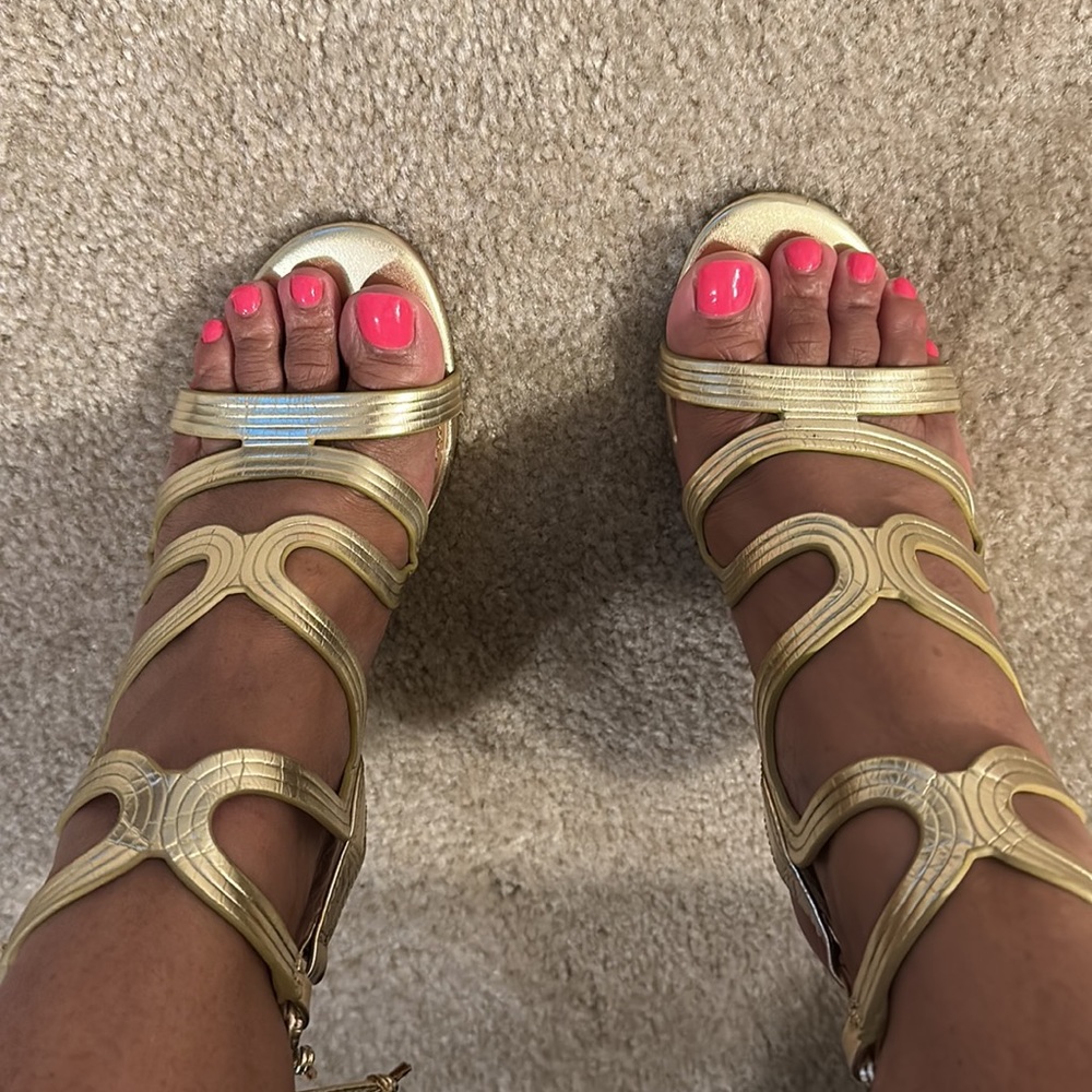Gold open toe heels.